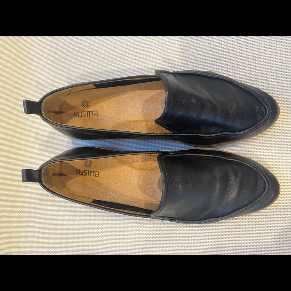 Black leather flats